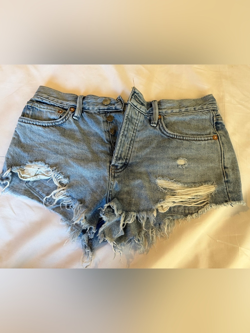 Free People
Distressed Light Blue High-Rise Denim Cutoff Shorts